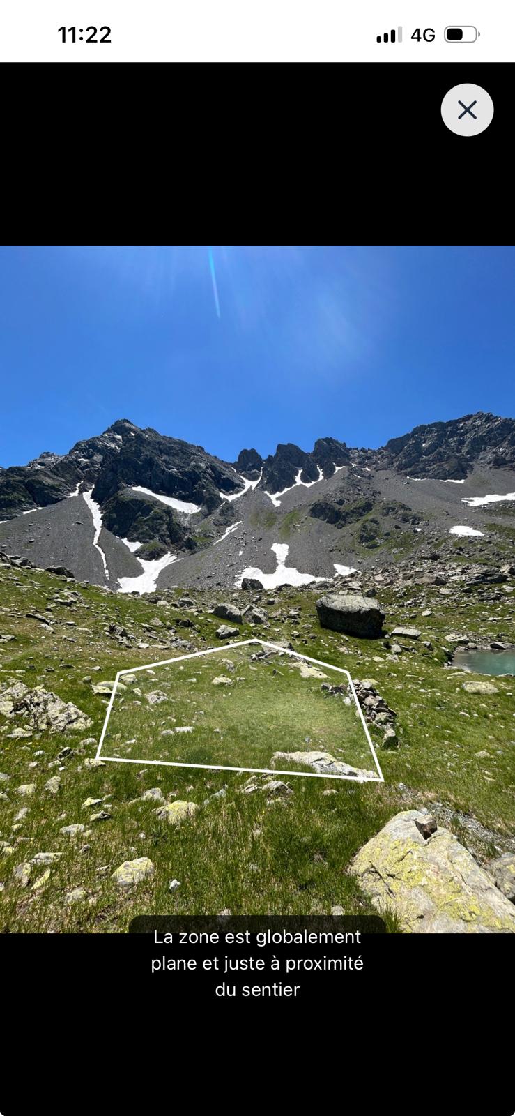 Bivouac application on mobile, full-screen photo of the spot with the pitch area outlined